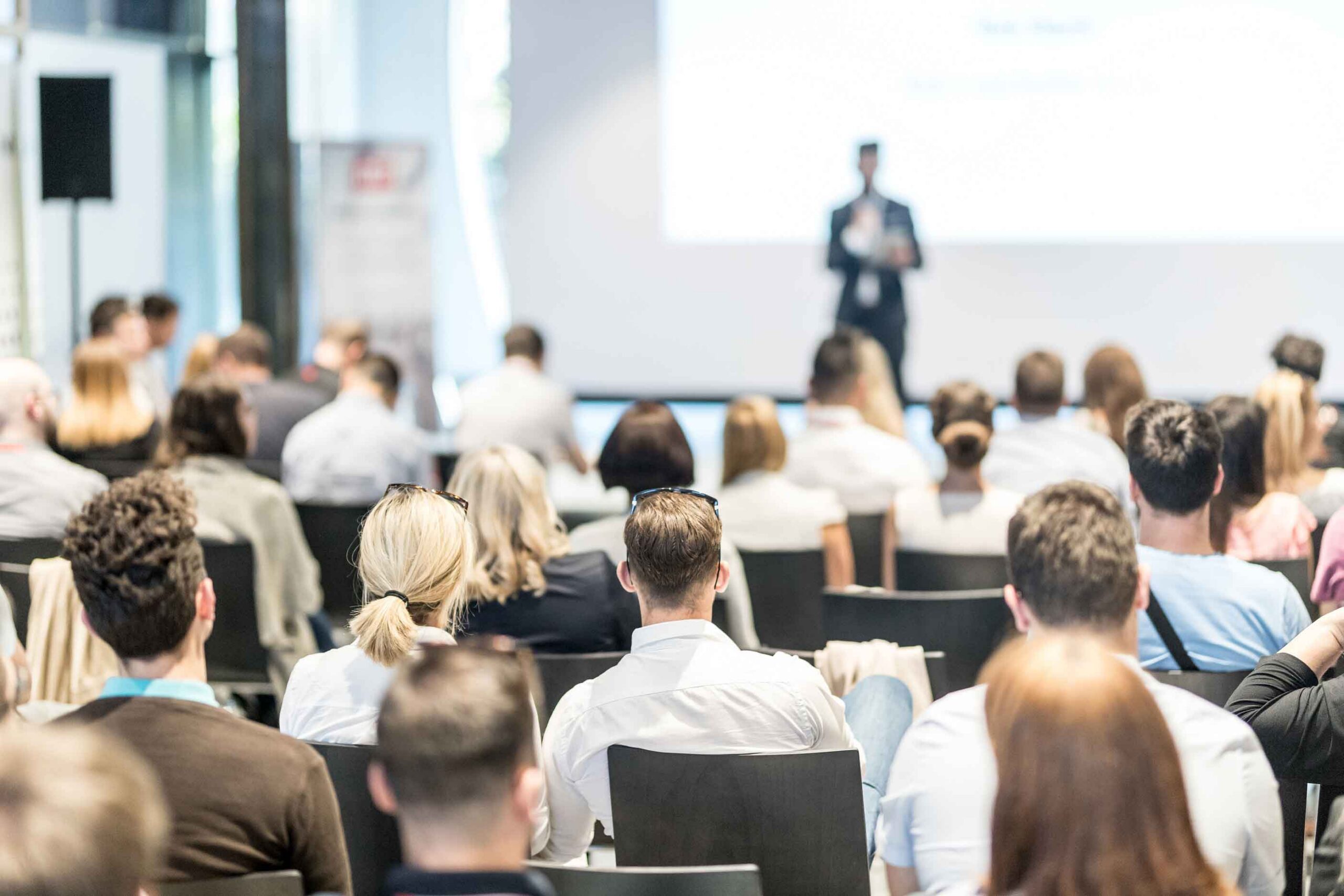 Male Business Speaker Giving A Talk At Conference Event